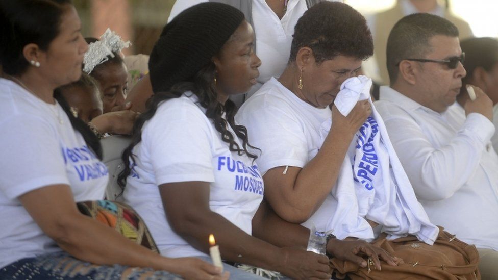 Victims of the 1994 La Chinita slaughter takes part in a meeting with leaders of the Farc