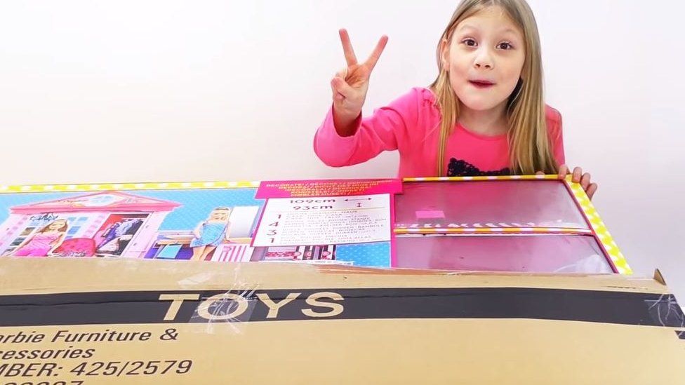 kid unboxing toys