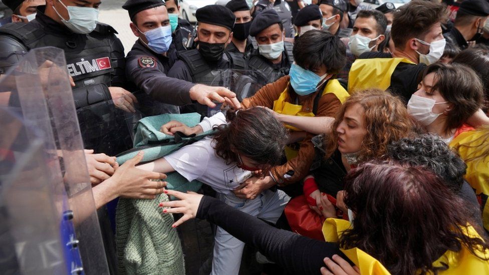 Turkish riot police officers scuffle with demonstrators in Istanbul