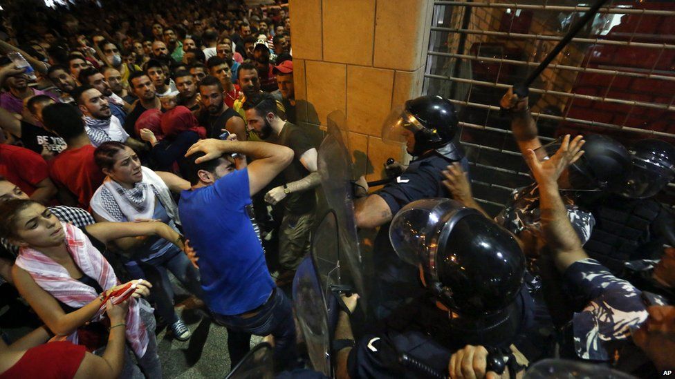 Lebanese protesters clash with police outside the environment ministry