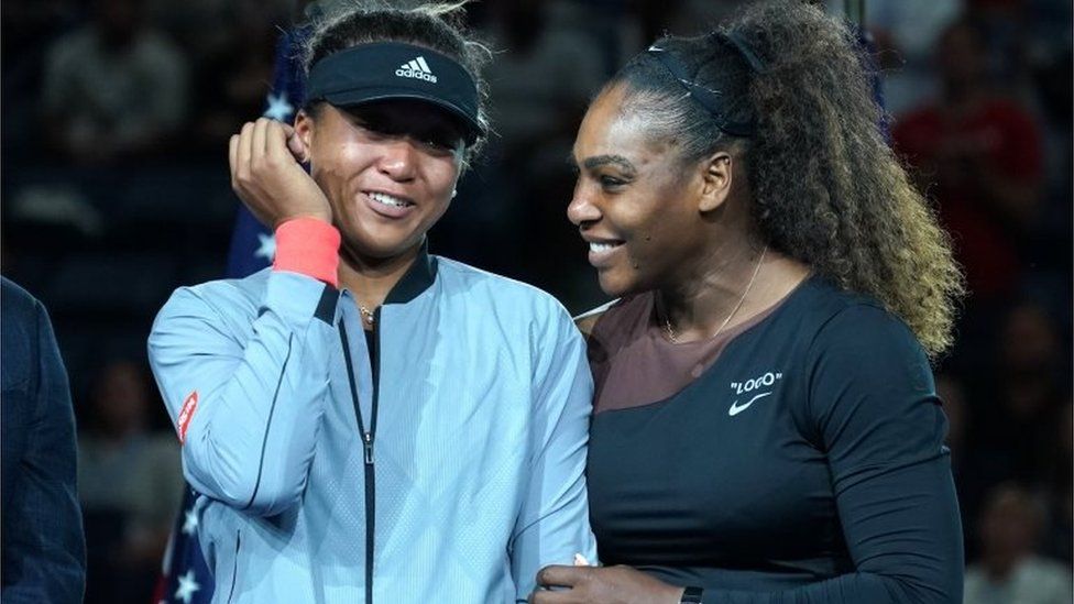 Serena Williams laughs with a tearful Naomi Osaka after the Japanese player's US Open victory