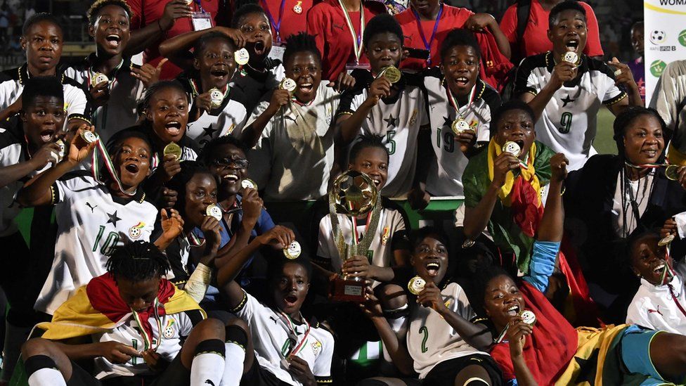 Ghana team players celebrate with trophy after winning the first West African Football Union (UFOA) zone B women"s tournament final match between Ghana and Ivory Coast at the Parcs des Sports in Abidjan on February 24, 2018
