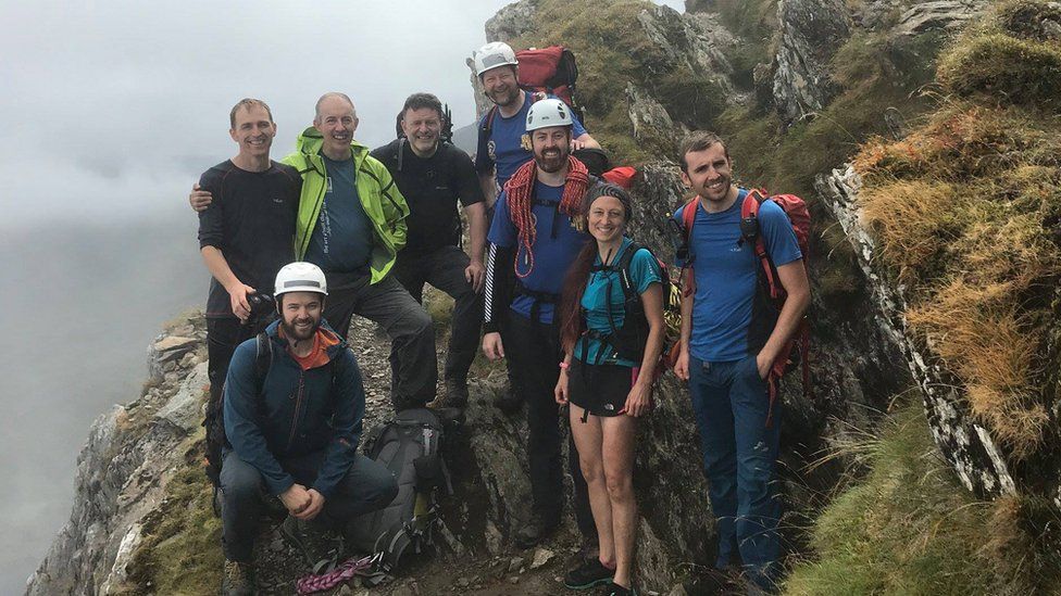 Eight members of the rescue team on a ridge