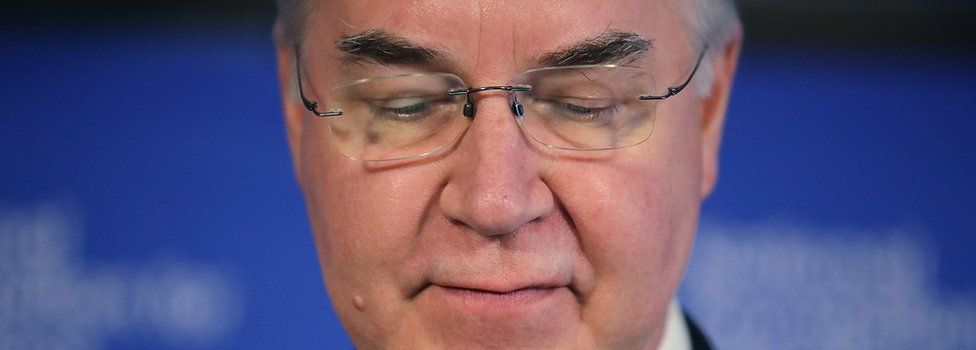 Tom Price looks downward during a press briefing file photo