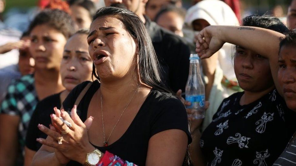 Relatives of inmates react in front of a prison complex in the Brazilian state of Amazonas after prisoners were found strangled to death in four separate jails, according to the penitentiary department in Manaus, Brazil May 27, 2019