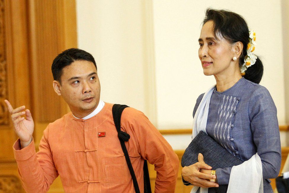 National League for Democracy party (NLD) leader Aung San Suu Kyi and Member of Parliament Thaw leave after attending a lower house of parliament meeting at Naypyitaw