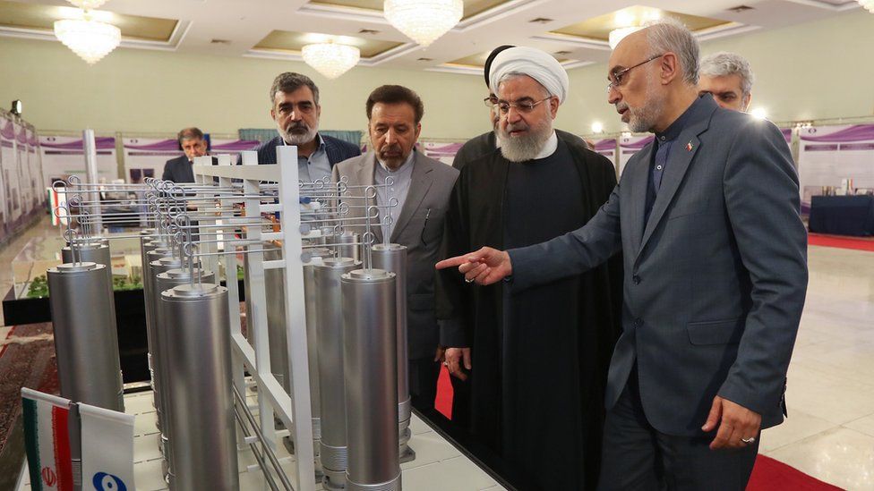 Iranian President Hassan Rouhani (C) and head of Iran nuclear technology organization Ali Akbar Salehi