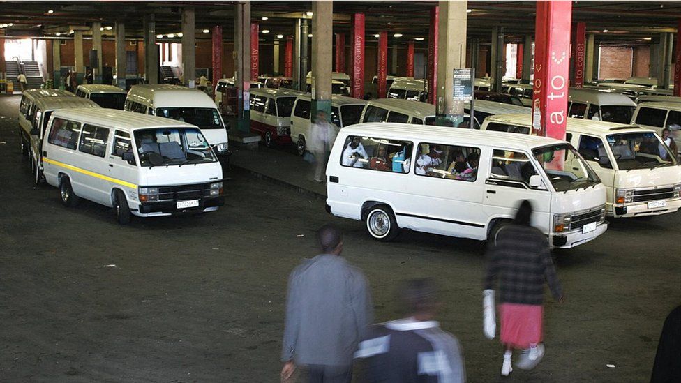 South Africans walk to taxis at the Bree taxi rank on June 4, 2009 in Johannesburg