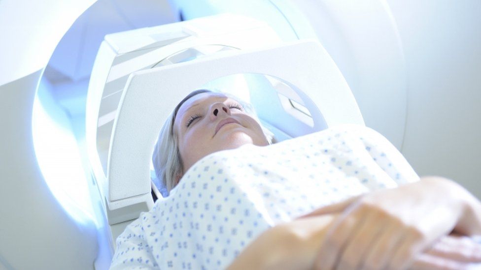 Woman having MRI scan