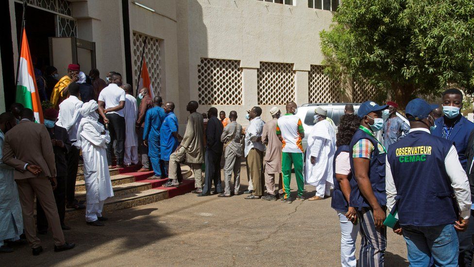 Voters queue at a polling station during the second round of the country's presidential election, in Niamey, Niger February 21, 2021.