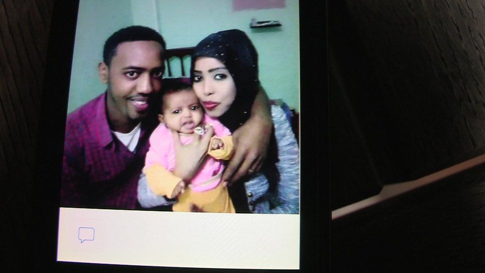 A photo of Muaz Ayimo with his wife and his daughter who died in the sinking