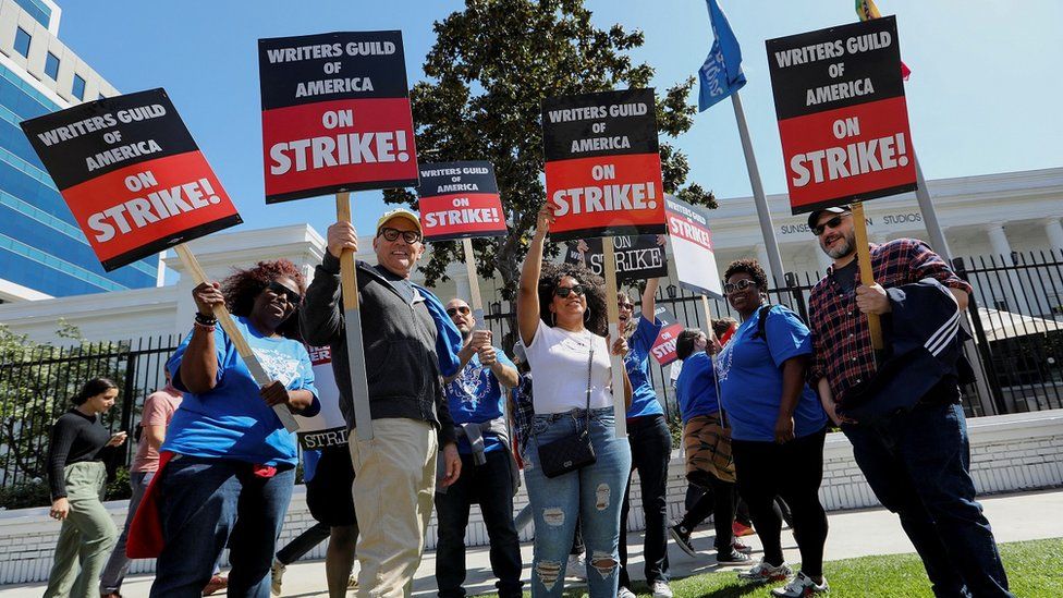 Workers and supporters of the Writers Guild of America protest outside the Netflix offices and Sunset Bronston Studio, the Old Warner Brothers Studios