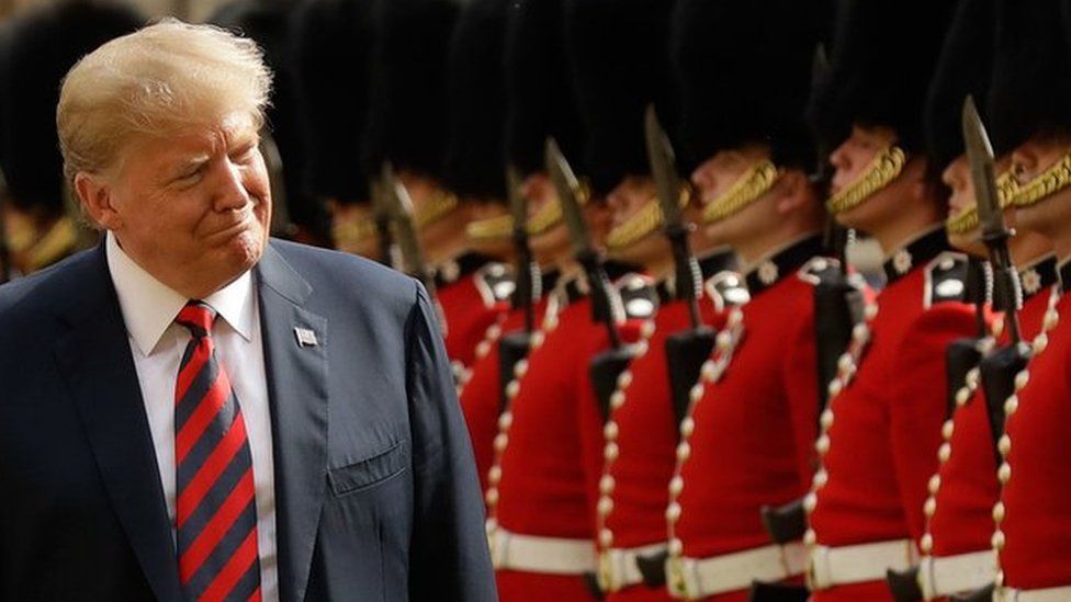 US President Donald Trump inspects the guard of honour formed of the Coldstream Guards during a welcome ceremony at Windsor Castle in Windsor, west of London
