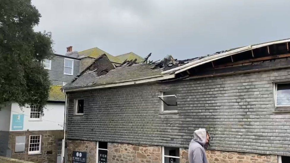 Burnt out roof of fish and chip shop