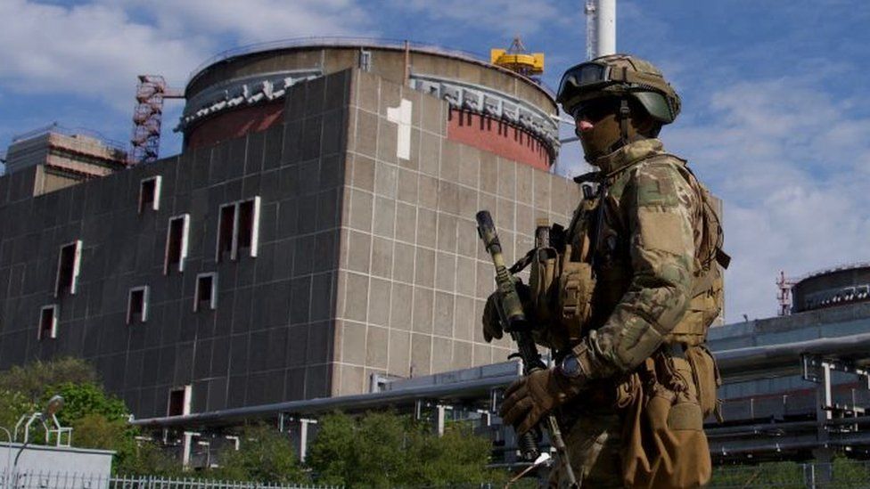 A Russian soldier guards Zaporizhzhia power plant