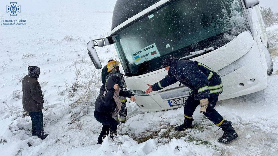 Rescuers evacuate passengers stuck in a bus in Odesa region, southern Ukraine