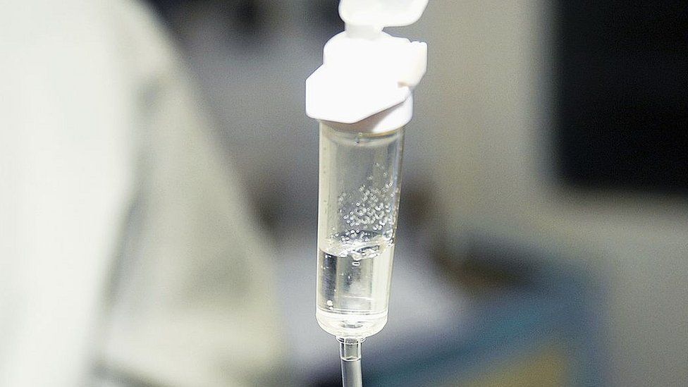 File image of an Intravenous drip, leading from saline solution bag