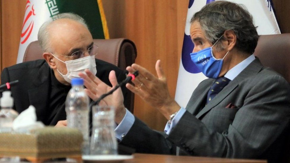 A handout photo made available by the Atomic Energy Organisation of Iran office shows its chief, Ali Akbar Salehi (L), and the Director General of the International Atomic Energy Agency (IAEA), Rafael Mariano Grossi (R), during a joint press conference in Tehran, Iran (25 August 2020)