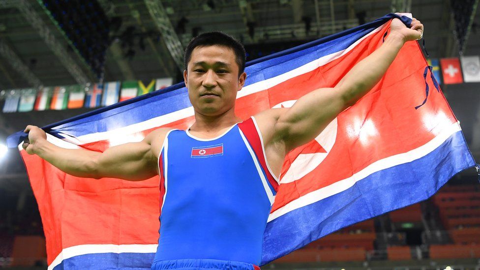 Ri Se-gwang, holding the North Korean flag, winning gold for North Korea in the vault at the 2016 Rio Olympics