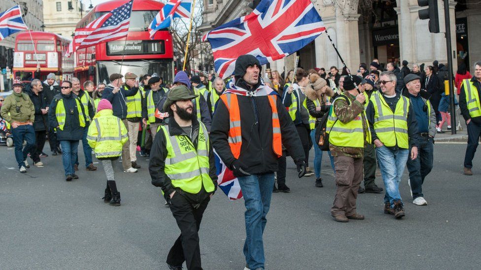 Pro-Brexit 'yellow vest' activists clash with police on Haymarket in London