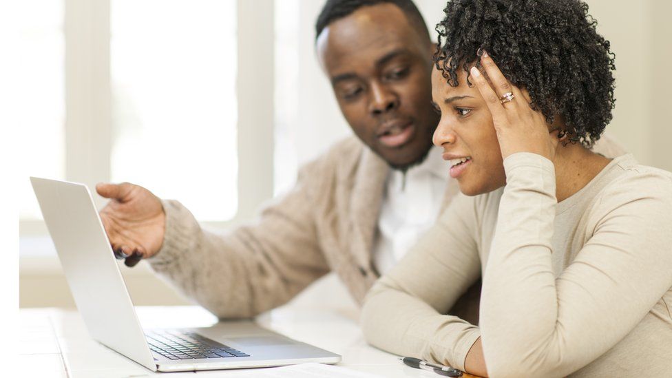 Couple looking at laptop screen