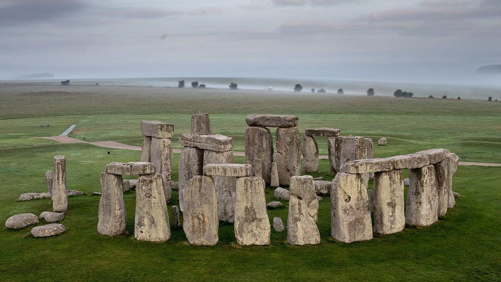 Stonehenge stones shown from an aerial position with the plain in the background