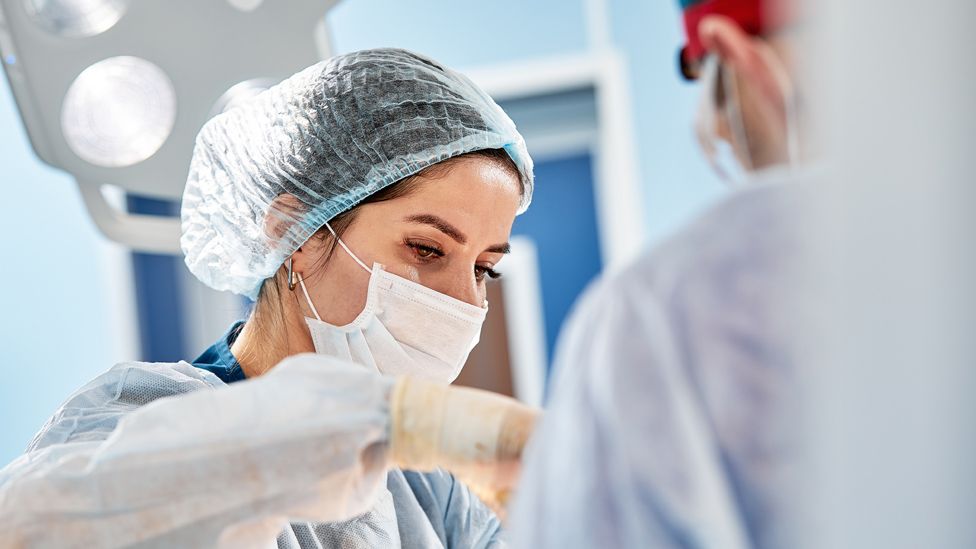 Surgeons at work in an operating theatre