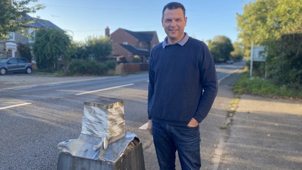 Matt Sealby with one of the stumps that is all that remains of the Magpie sign on the A140 at Stonham