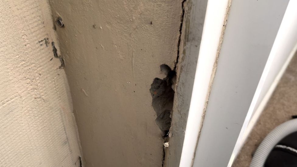 Cracks by door frame