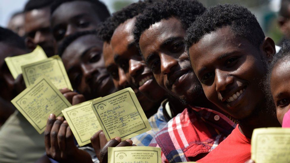 Voters pose with their identity documents during the Sidama referendum in Hawassa, Ethiopia - Wednesday 20 November 2019