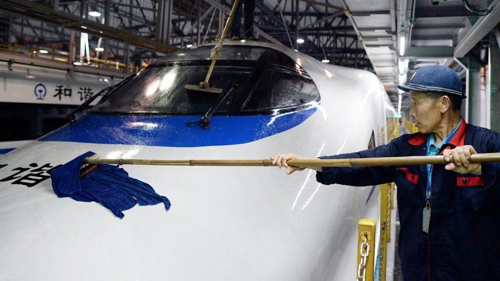 Man cleaning a train