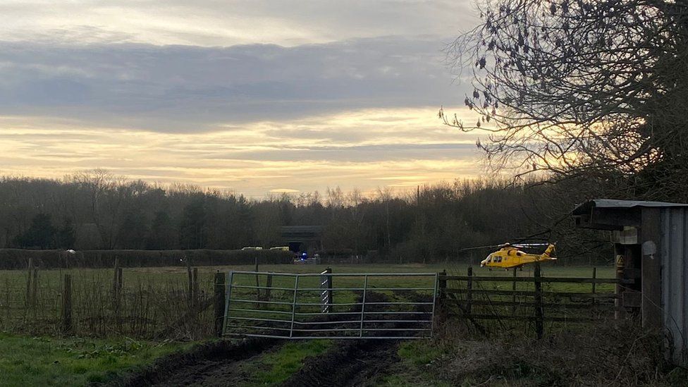 View of helicopter landing in field in Bearsted, near Maidstone