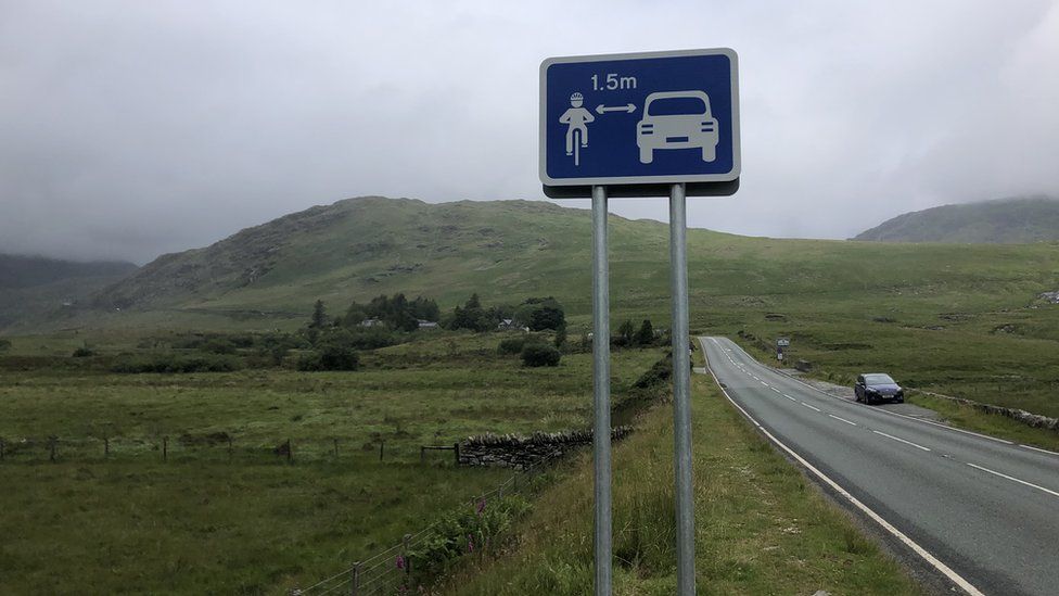 A sign urging motorists to pass cyclists at 1.5m