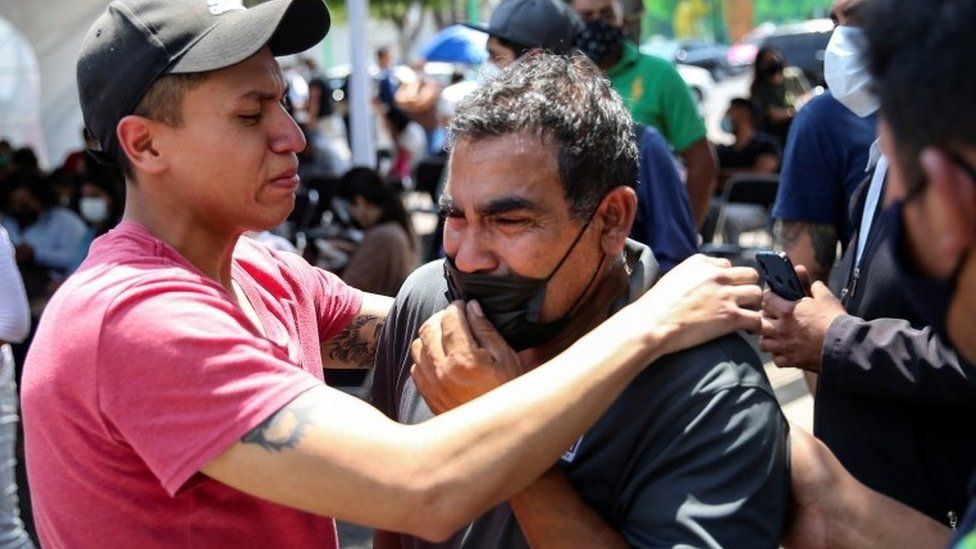 Relatives of the victims react outside the Prosecutors Office in Iztapalapa neighbourhood, after an overpass of the metro partially collapsed with train cars on it, in Mexico City