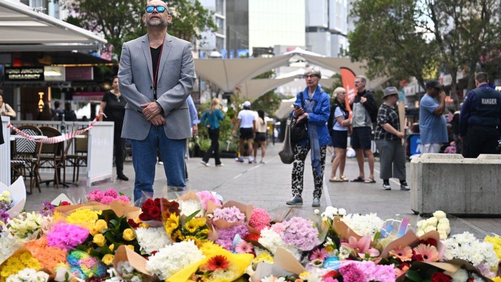 Flowers lie at the scene now in tribute to the mall attack victims, 14 Apr 24