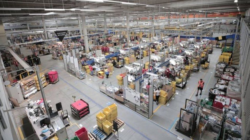 The Amazon Workers at UK Warehouse Walk Out Over Pay Discontent.