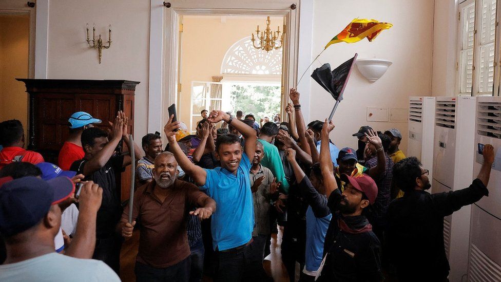 Demonstrators celebrate after entering the President's House during a protest, after President Gotabaya Rajapaksa fled, amid the country's economic crisis, in Colombo, Sri Lanka July 9, 2022.