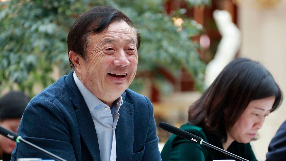 Huawei founder Ren Zhengfei (L) speaking to Chinese media in Shenzhen