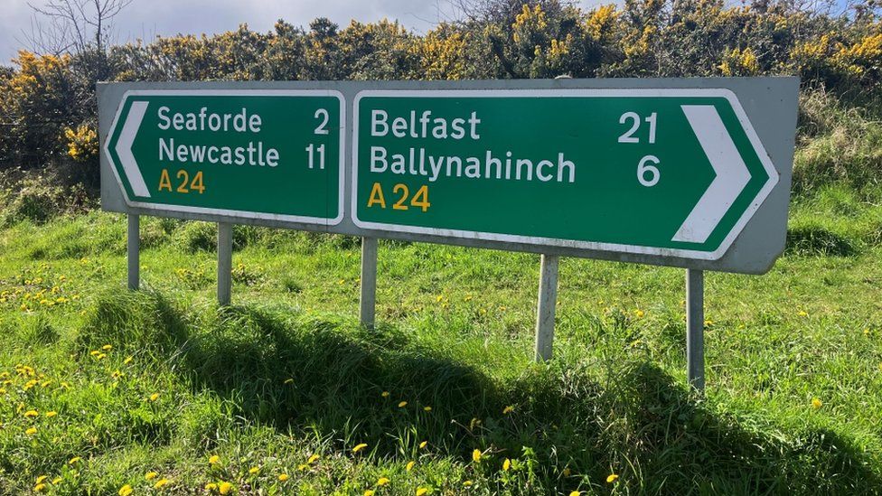 Road signs showing Seaforde, Newcastle, Belfast and Ballynahinch