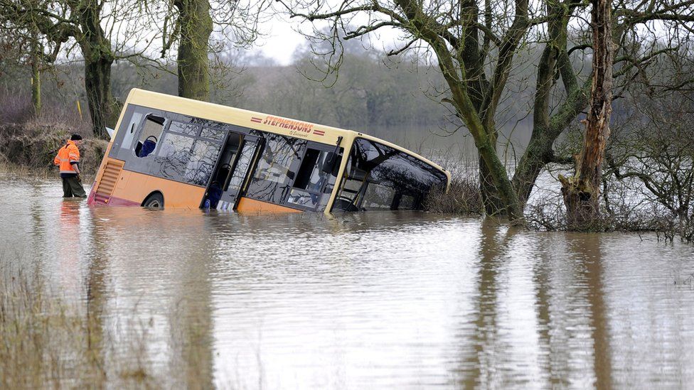 Bus trapped in flood water north of York