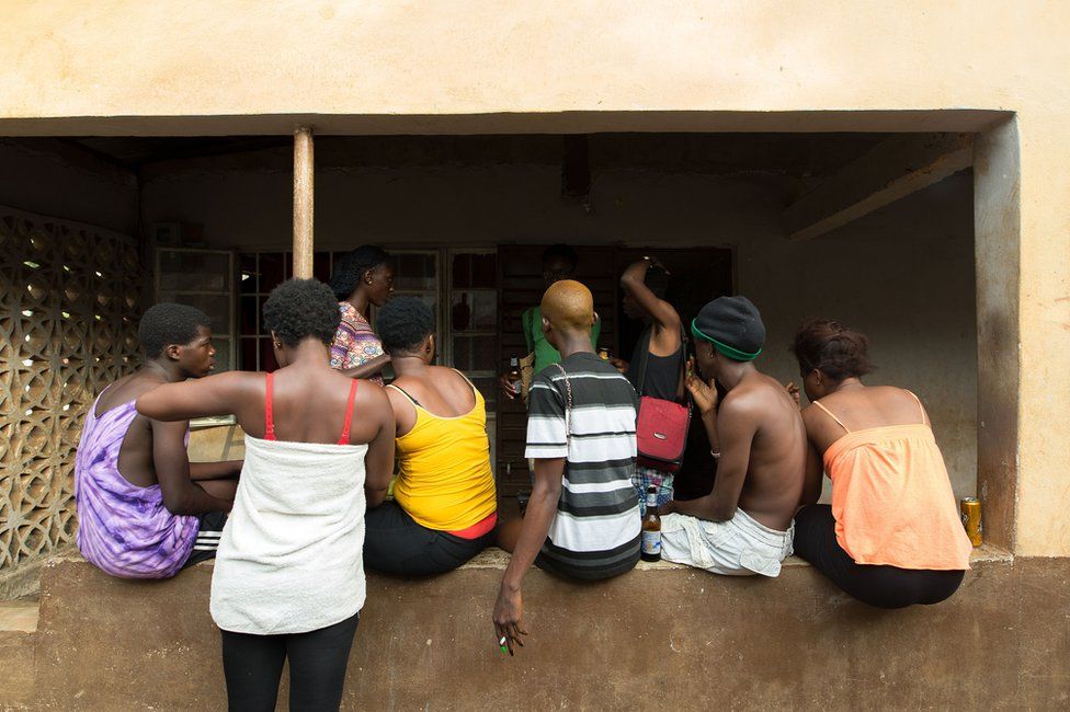 People hanging outside a house