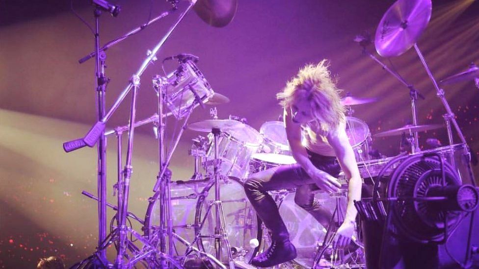 Yoshiki behind his drum kit