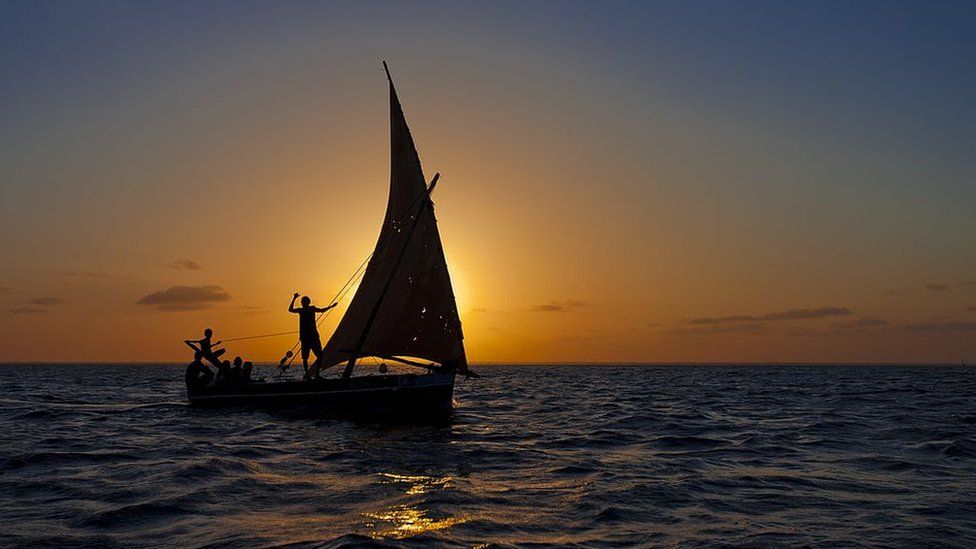 Dhow boat at sunrise off Lamu in Kenya.