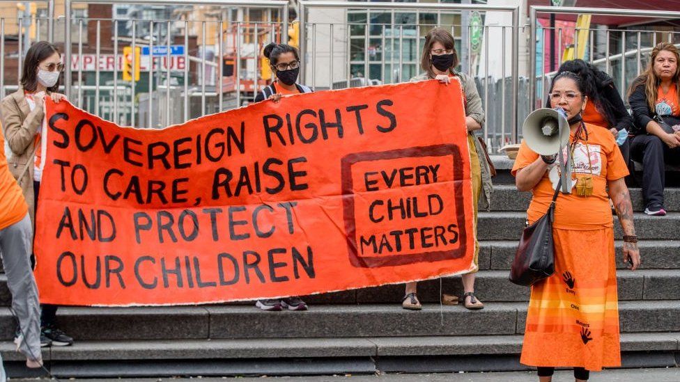 Activist Binesi Ogichidaa speaks during the Orange Shirt Day and National Day of Truth and Reconciliation at Dundas Square, to heal, raise awareness and rise together as an Indigenous Community. Organized by Matriarchal Circle, a Toronto-based grassroots organization impacted by child welfare agencies. The Matriarchal Circle's vision is for child welfare to be practiced in Toronto in true Indigenous grassroots led circles, "as opposed to the neo-colonial, oppressive, genocidal acts in the current child welfare system