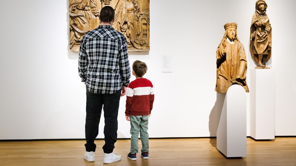 Man and boy in museum