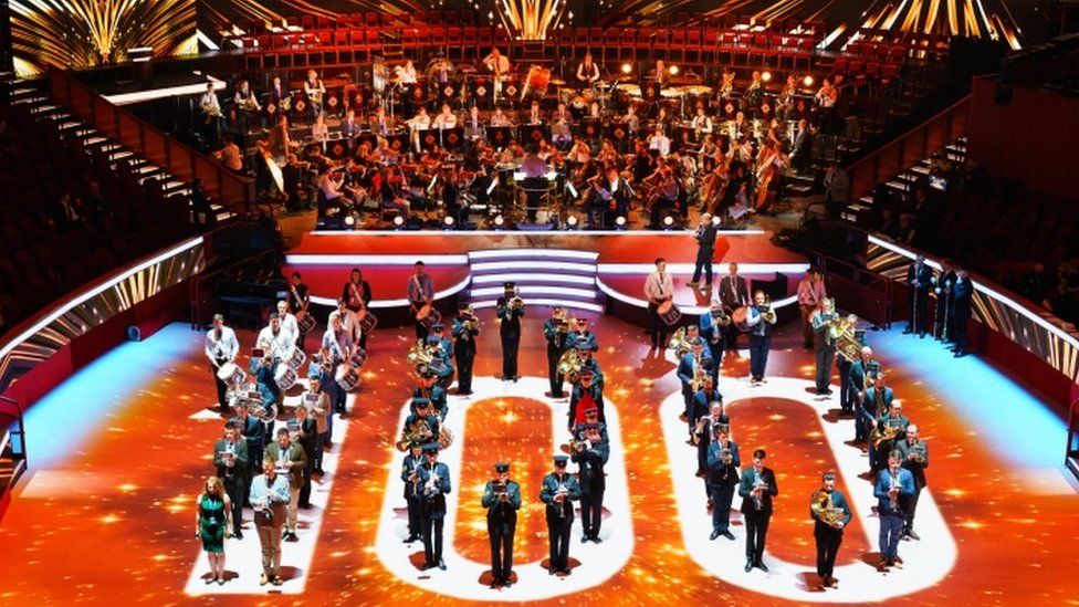 Members of the armed forces rehearse a "100" formation at the Royal Albert Hall ahead of Saturday's festival