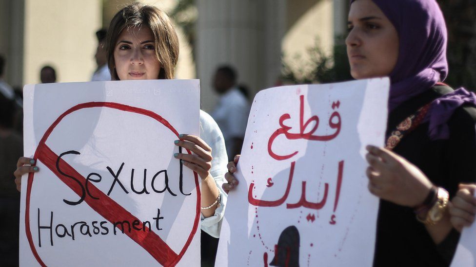 Egyptian women hold signs during a protest against sexual harassment in Cairo, Egypt, 14 June 2018
