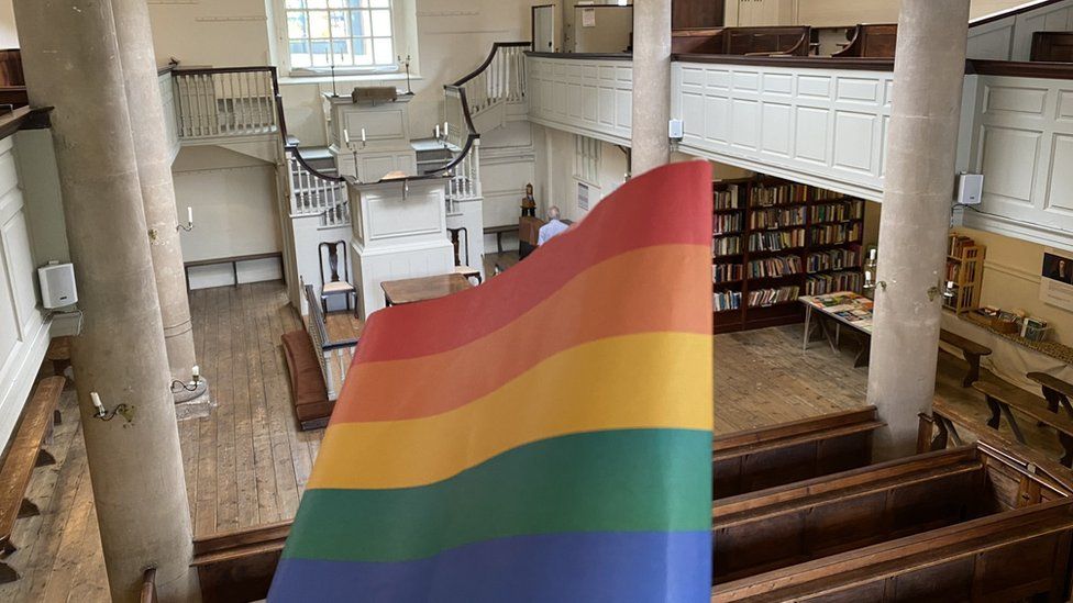 View of the inside of the Chapel with a Pride flag