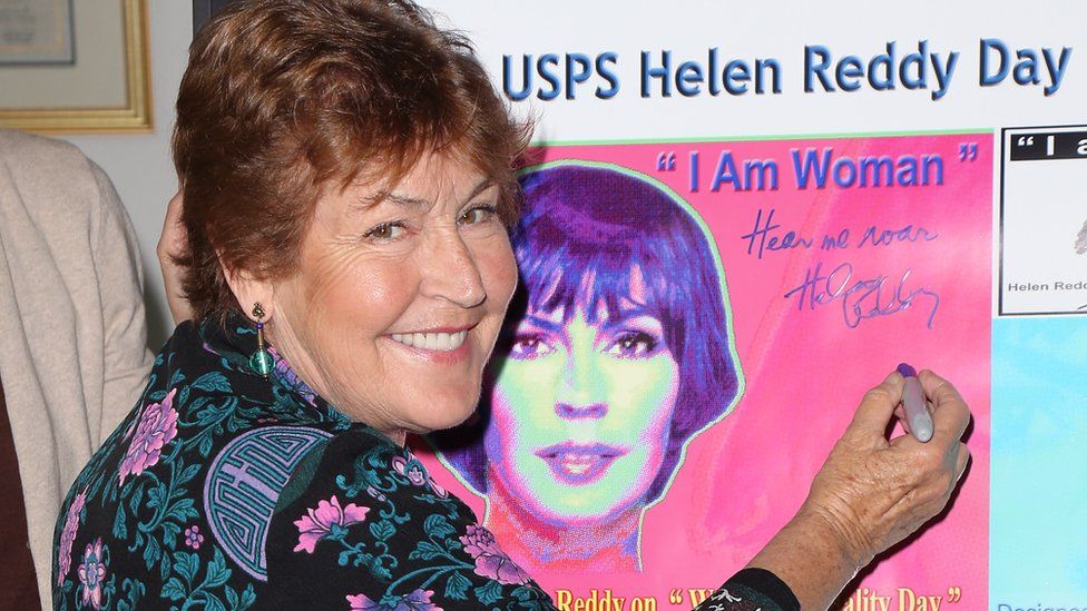 Helen Reddy signing an I Am Woman poster in Hollywood in 2013