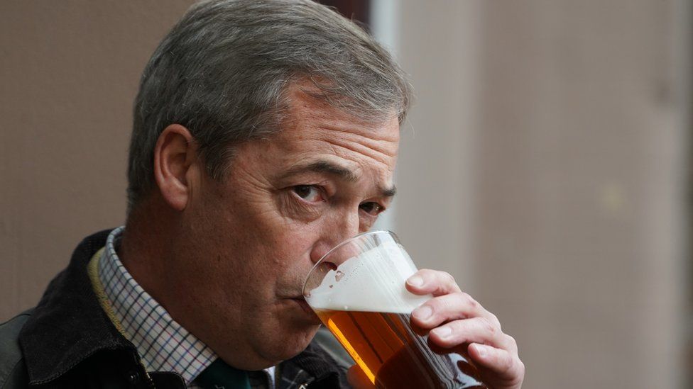 Nigel Farage drinks a pint of beer